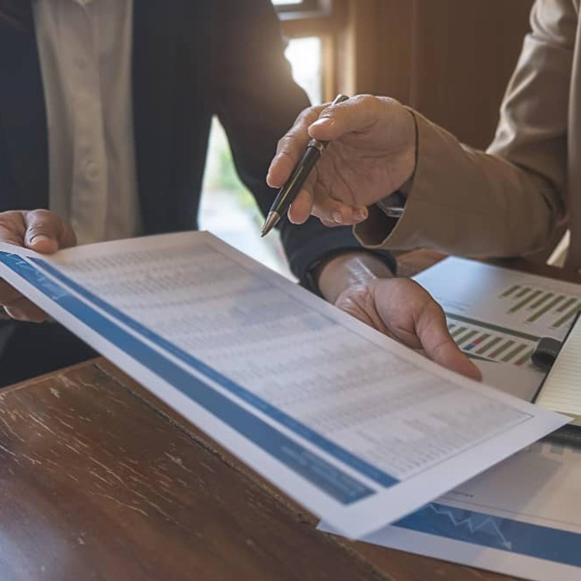 Reviewing behavioral case files at desk in Orange County CA