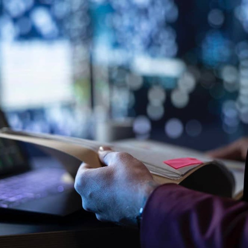 Investigator analyzing case data on laptop in Orange County CA